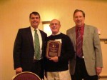 Tom Alvarez - center - receives the Hall of Fame Award posted on MHProNews.com